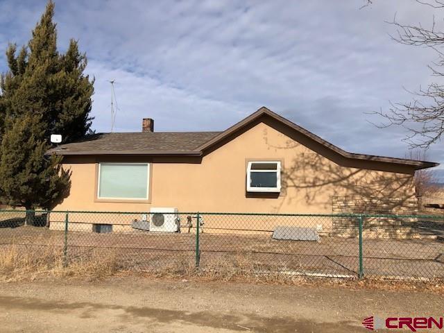 1862 9 Road Mack, CO 81525 - Photo 2 of 26 a view of a house with a yard
