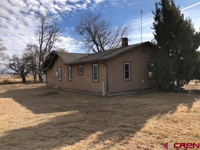 1862 9 Road Mack, CO 81525 - Photo 3 of 26 a view of a house with a yard