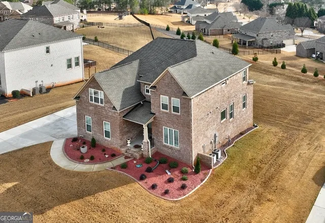 an aerial view of a house with outdoor space