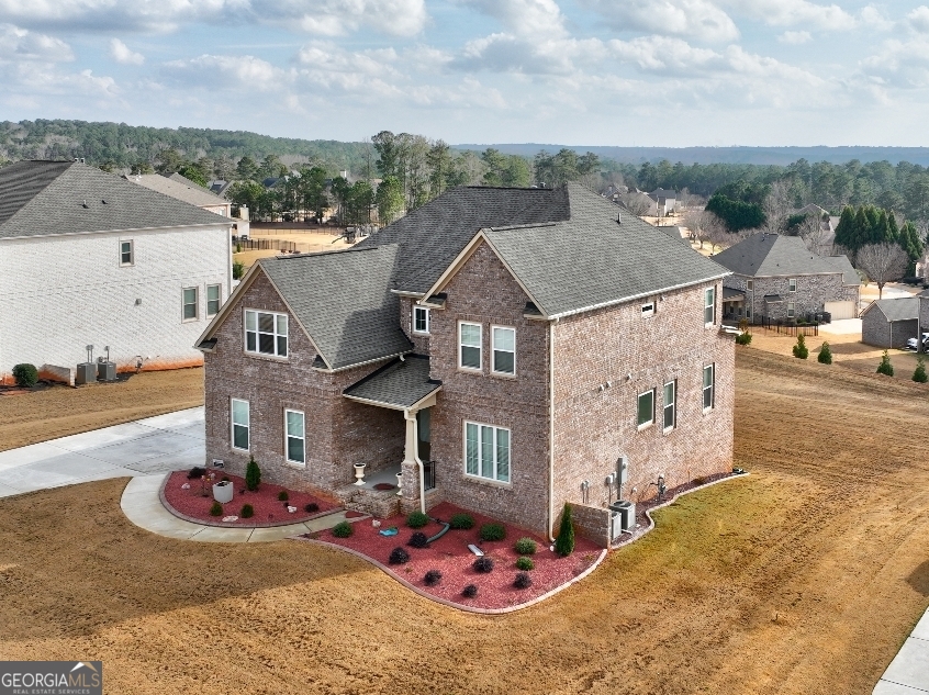 1522 Windward Locust Grove, GA 30248 - Photo 2 of 76 an aerial view of a house with a garden and lake view