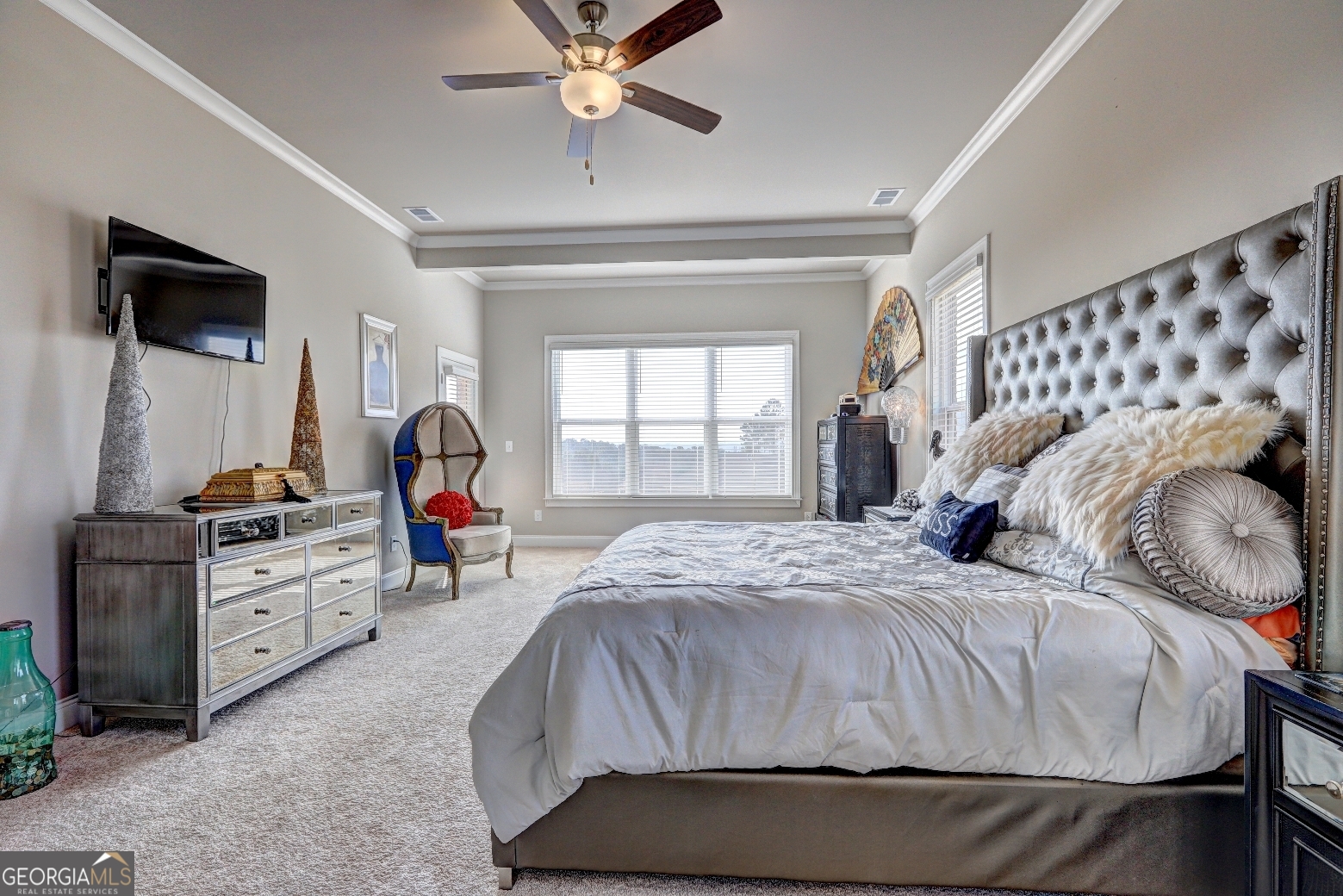 1522 Windward Locust Grove, GA 30248 - Photo 24 of 76 a bedroom with a bed and a chandelier