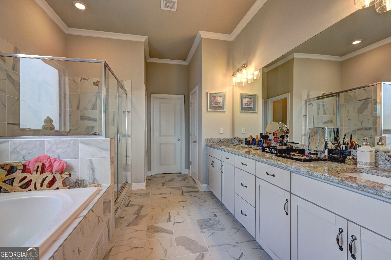 1522 Windward Locust Grove, GA 30248 - Photo 26 of 76 a spacious bathroom with a sink and a mirror