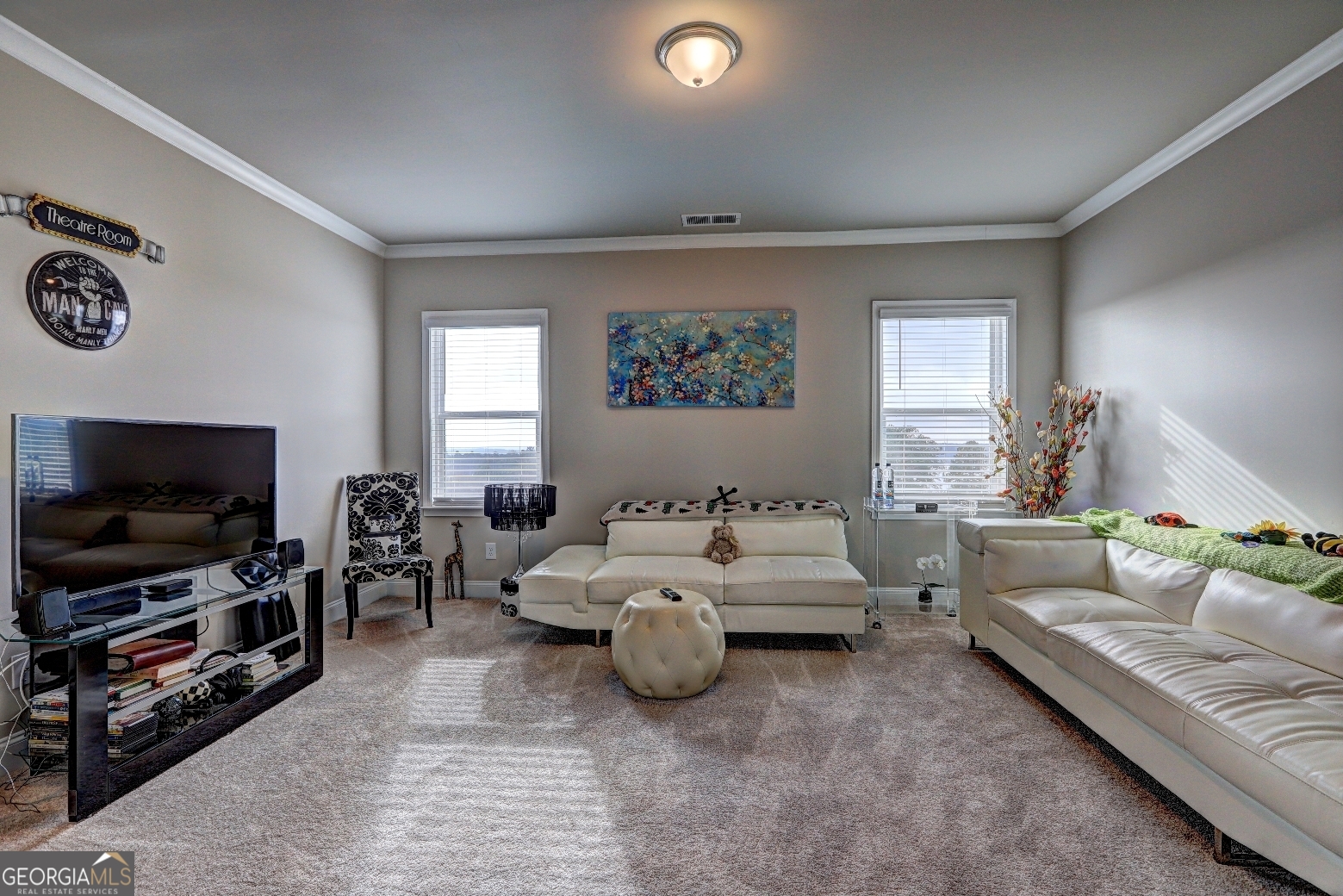 1522 Windward Locust Grove, GA 30248 - Photo 34 of 76 a living room with furniture and a flat screen tv