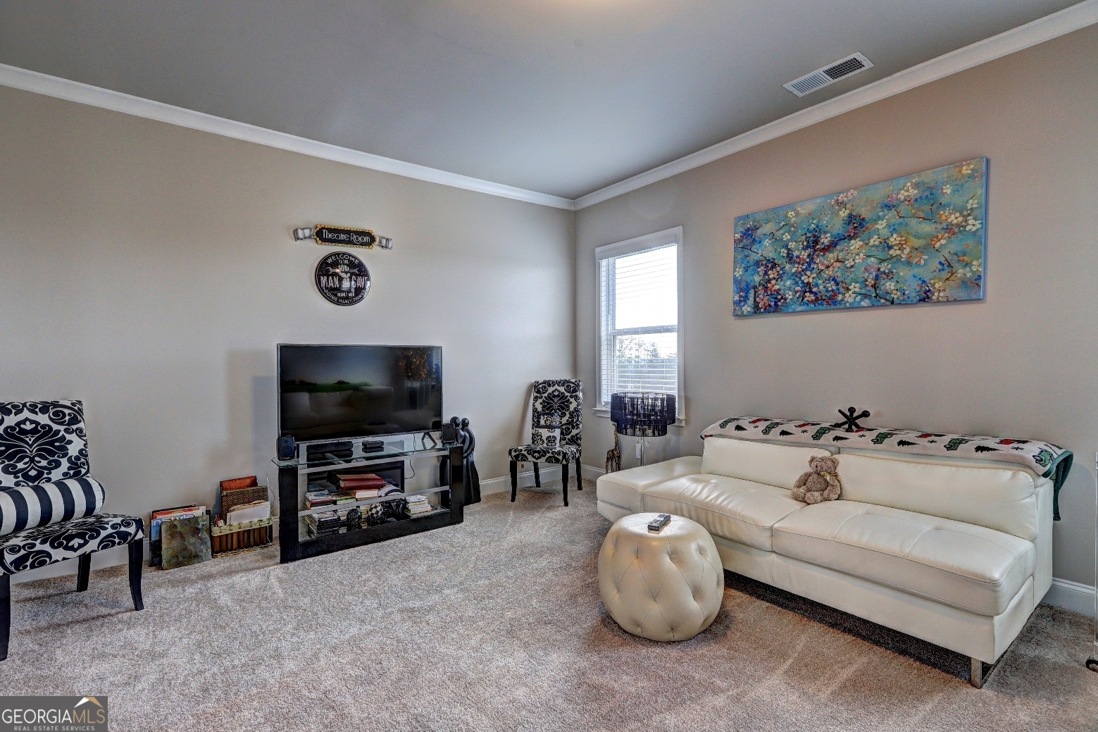 1522 Windward Locust Grove, GA 30248 - Photo 36 of 76 a living room with furniture and a flat screen tv