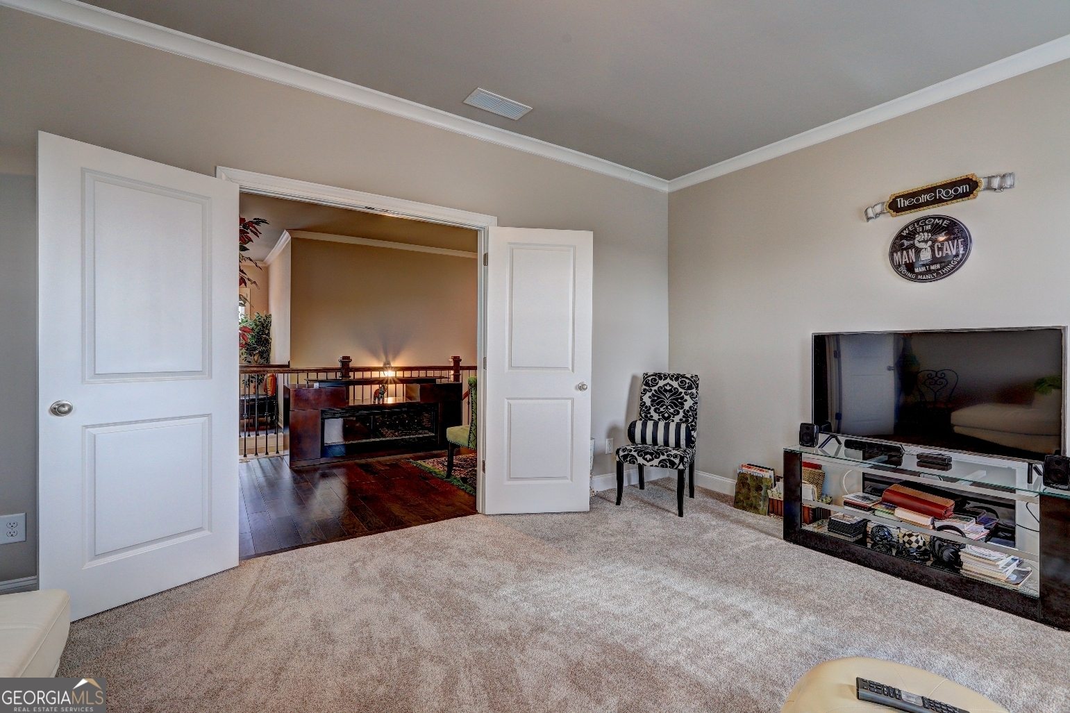 1522 Windward Locust Grove, GA 30248 - Photo 37 of 76 a living room with furniture and a flat screen tv