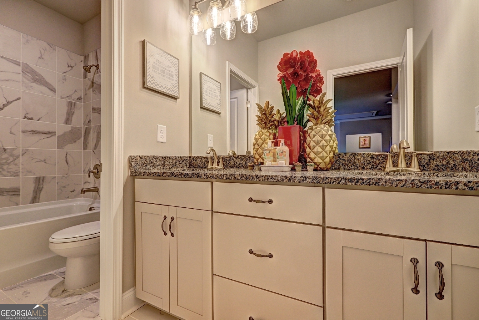 1522 Windward Locust Grove, GA 30248 - Photo 40 of 76 a bathroom with a granite countertop sink a toilet and mirror