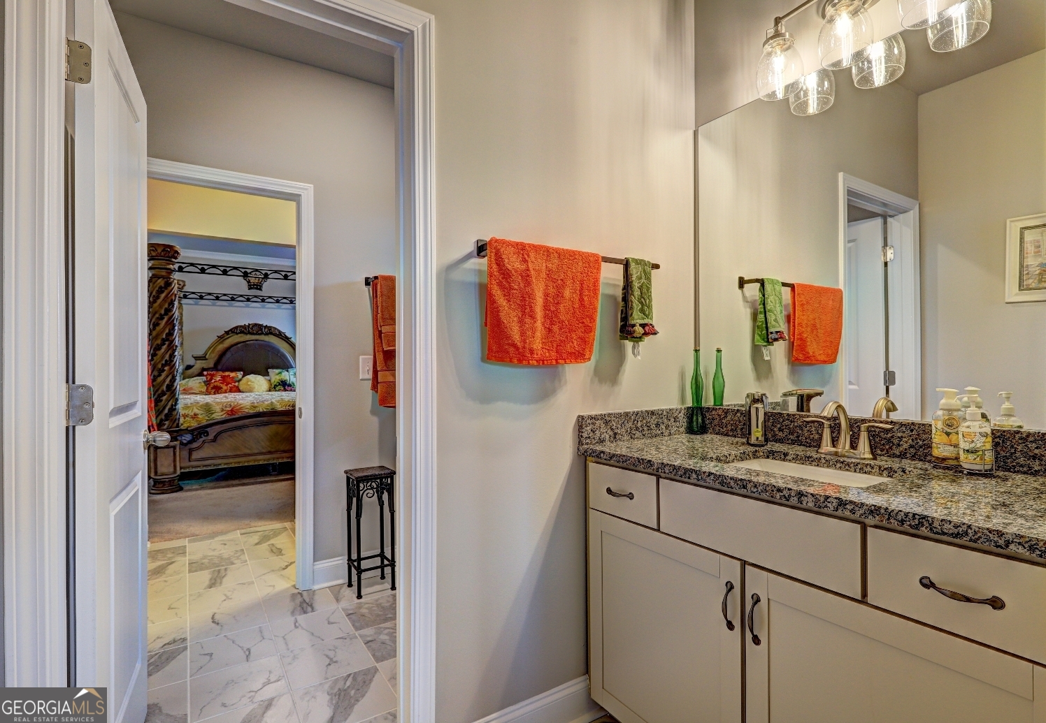 1522 Windward Locust Grove, GA 30248 - Photo 46 of 76 a en suite bathroom with a sink and a mirror