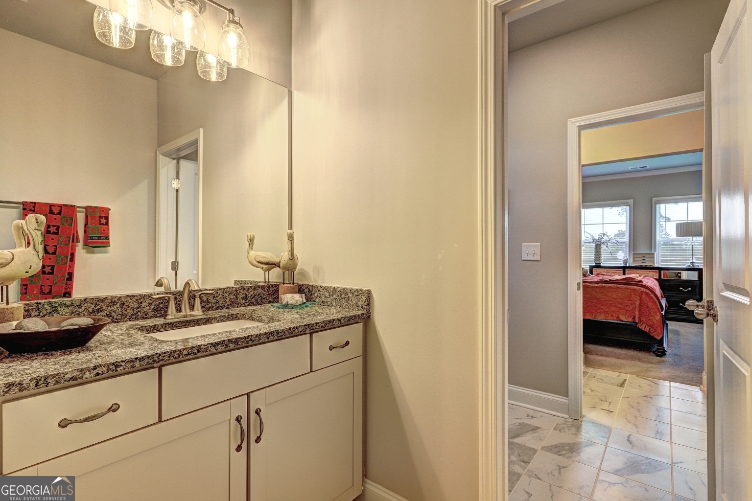 1522 Windward Locust Grove, GA 30248 - Photo 48 of 76 a en suite bathroom with a granite countertop sink and a mirror