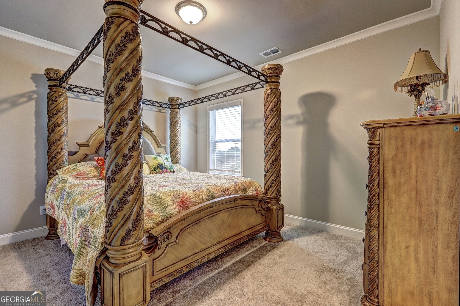 1522 Windward Locust Grove, GA 30248 - Photo 49 of 76 a bed sitting in a bedroom next to a window