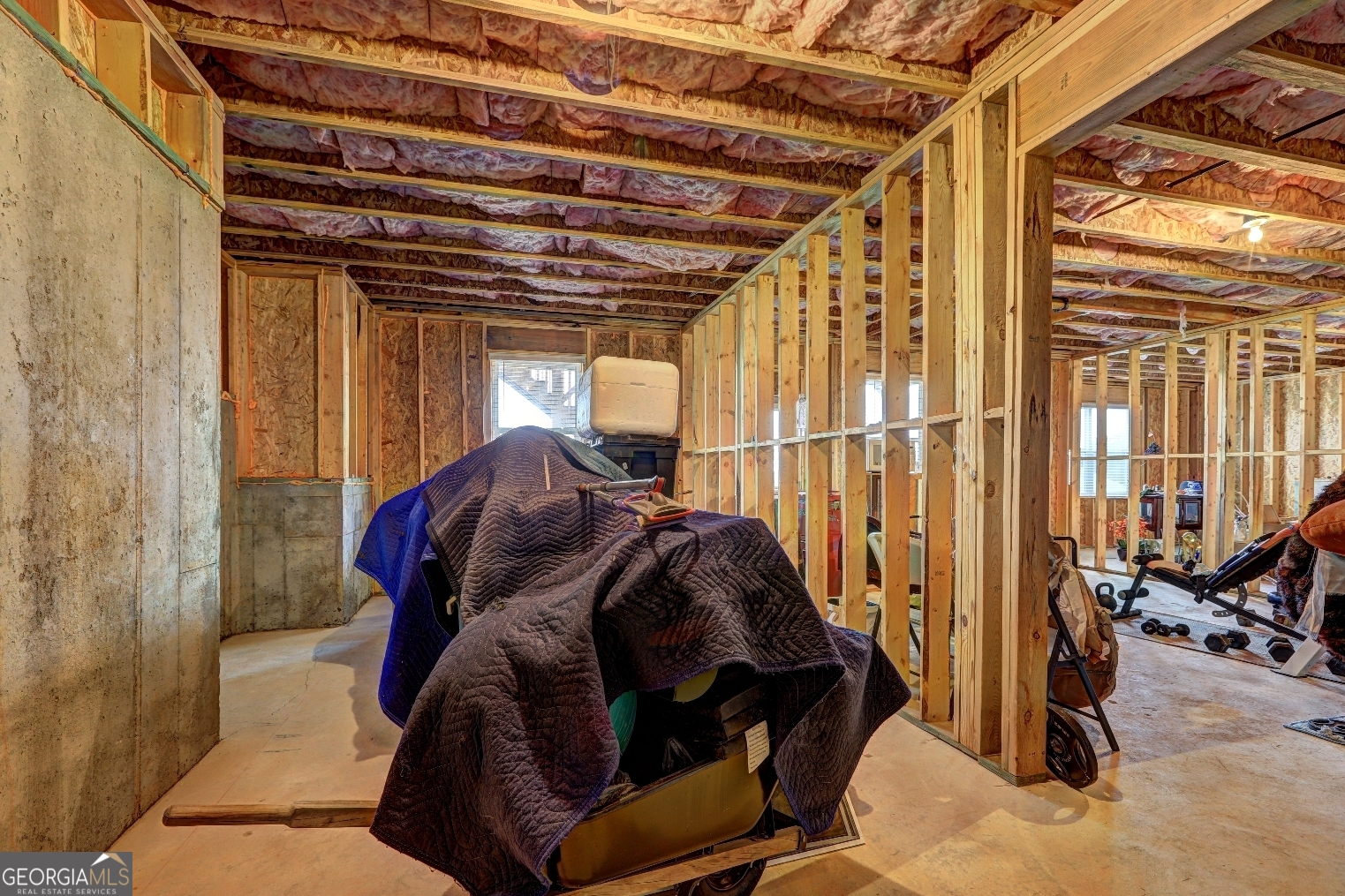 1522 Windward Locust Grove, GA 30248 - Photo 55 of 76 a view of walk in closet with clothes and shoes