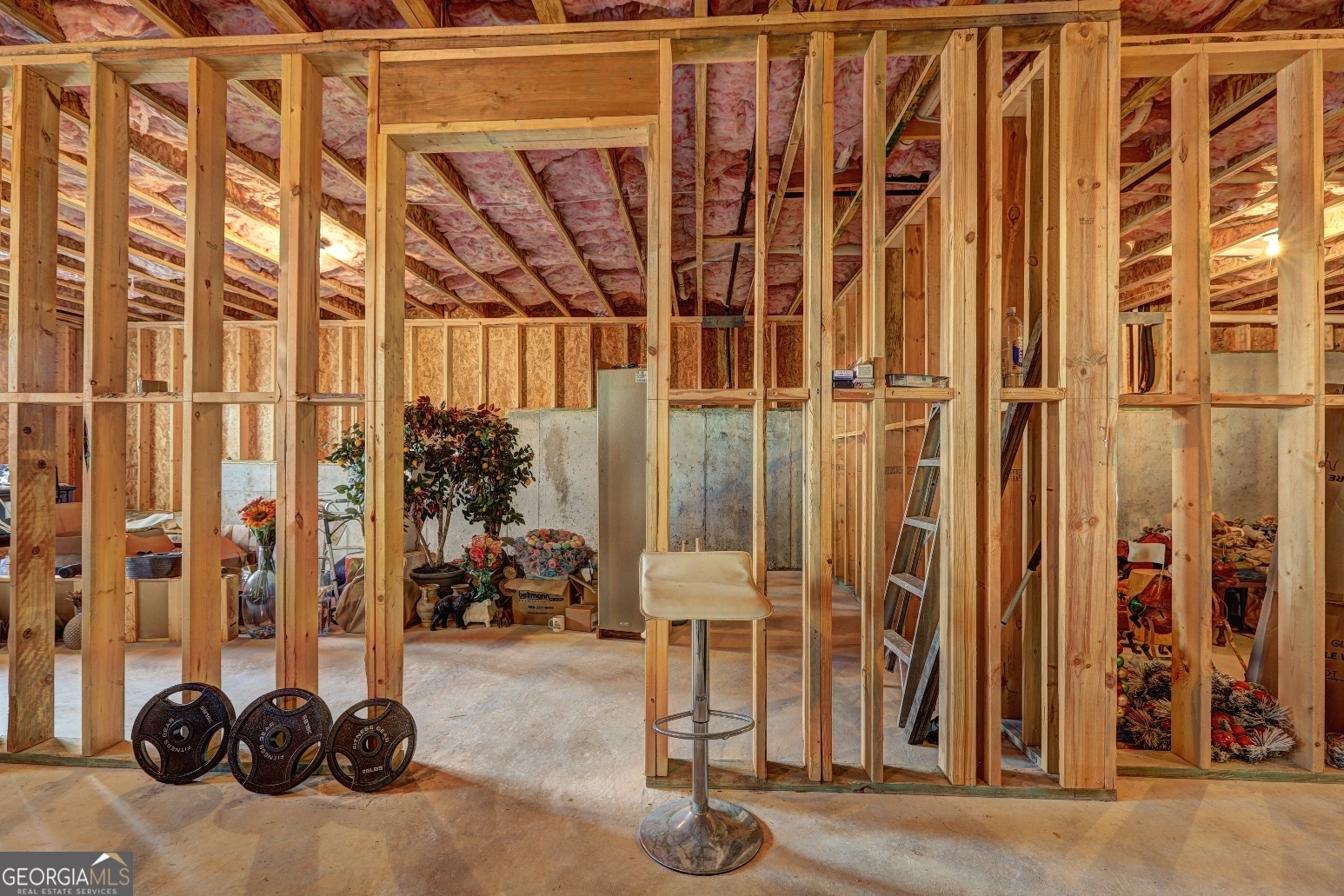 1522 Windward Locust Grove, GA 30248 - Photo 56 of 76 a view of walk in closet with clothes and shoes