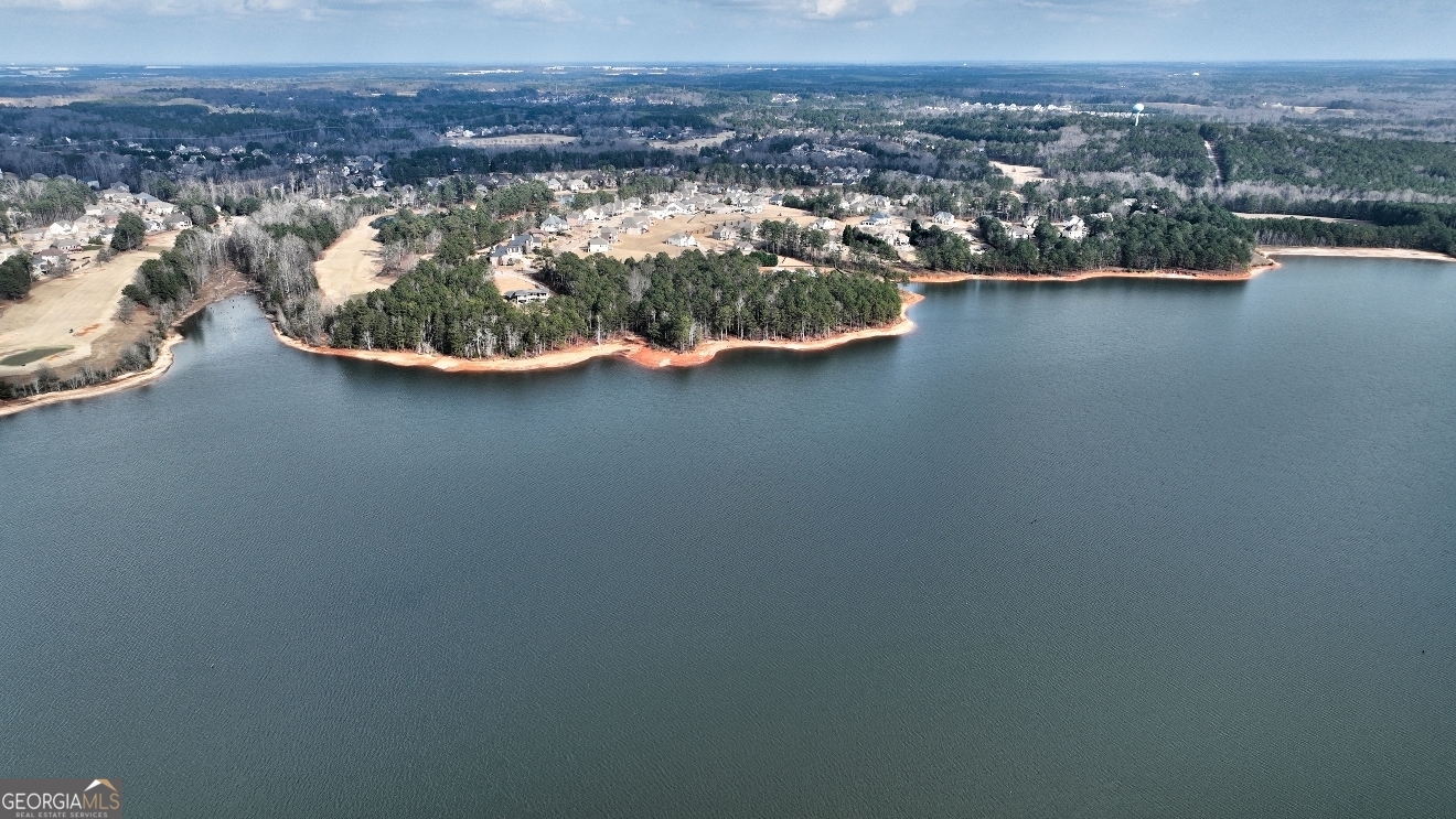1522 Windward Locust Grove, GA 30248 - Photo 73 of 76 an aerial view of a house with a yard and lake view