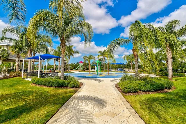 a view of a swimming pool with a yard
