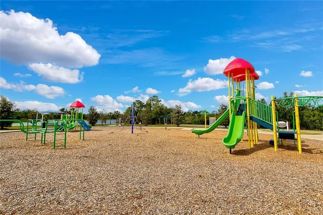 a view of a swimming pool with a fountain and a potted plants