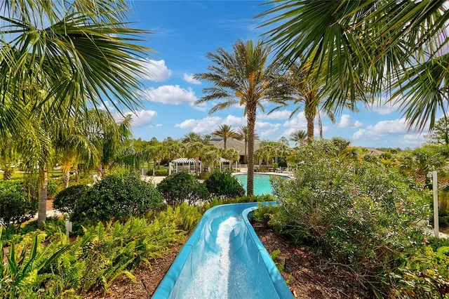 a view of a house with backyard and porch