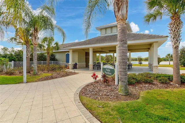 an aerial view of a house with swimming pool and outdoor space