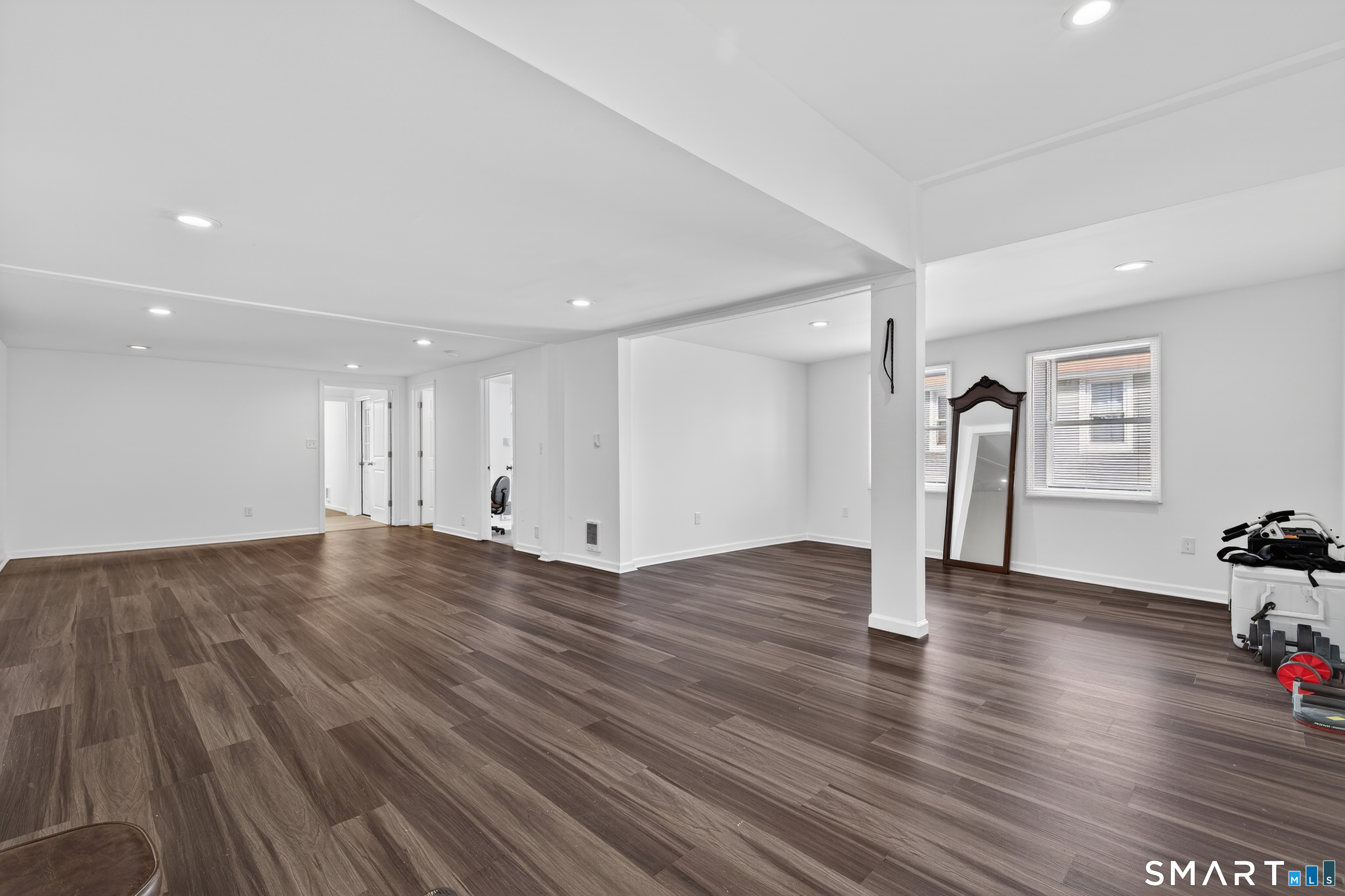 720 Baldwin Street Waterbury, CT 06706 - Photo 11 of 40 a view of empty room with wooden floor and window