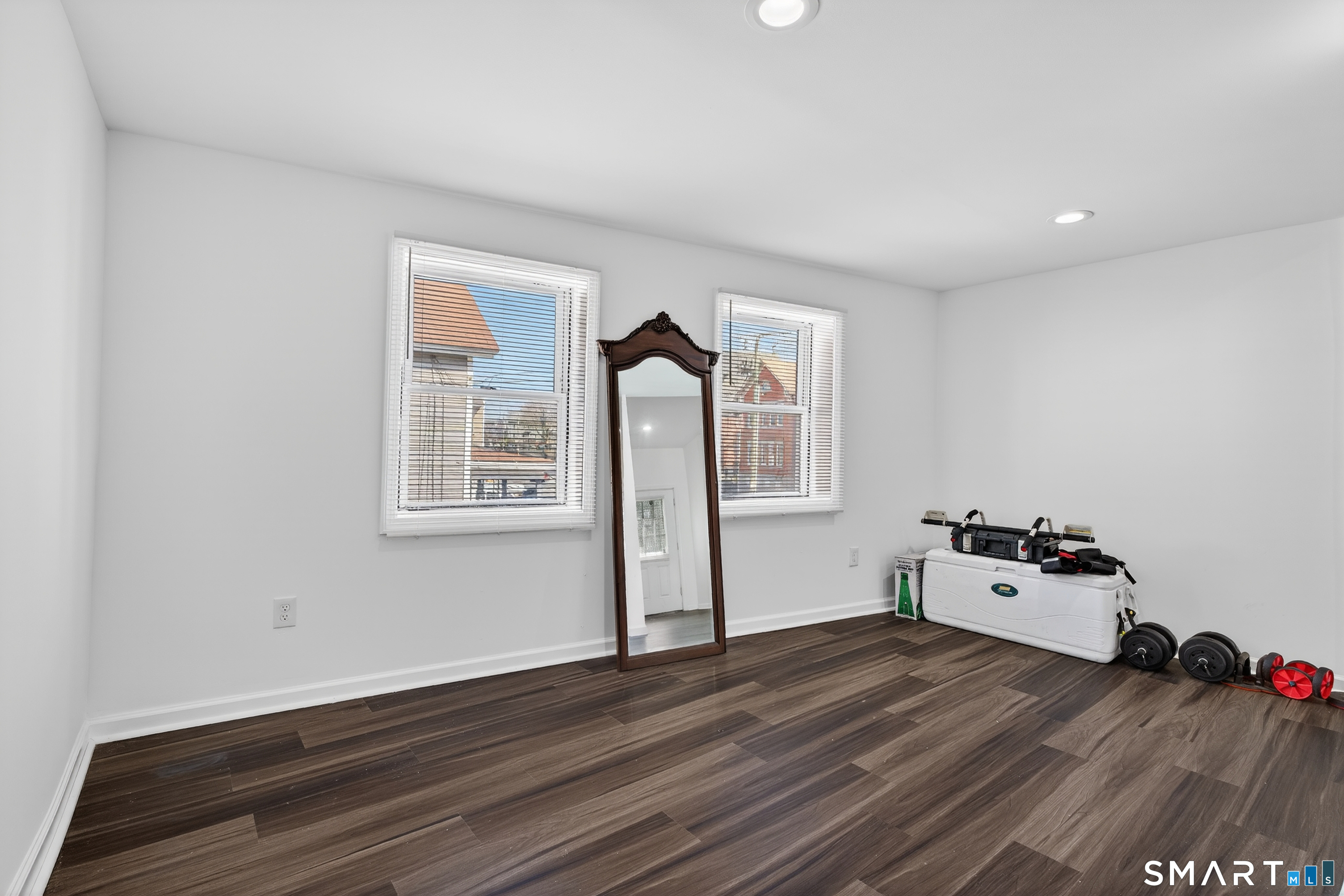 720 Baldwin Street Waterbury, CT 06706 - Photo 12 of 40 a hallway with wooden floor