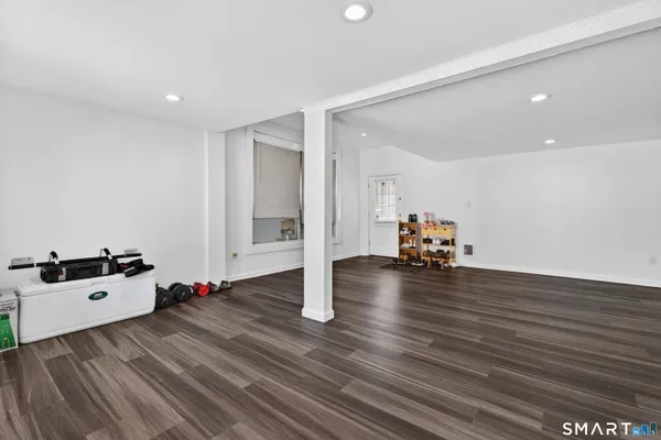 a view of a room with wooden floor and closet