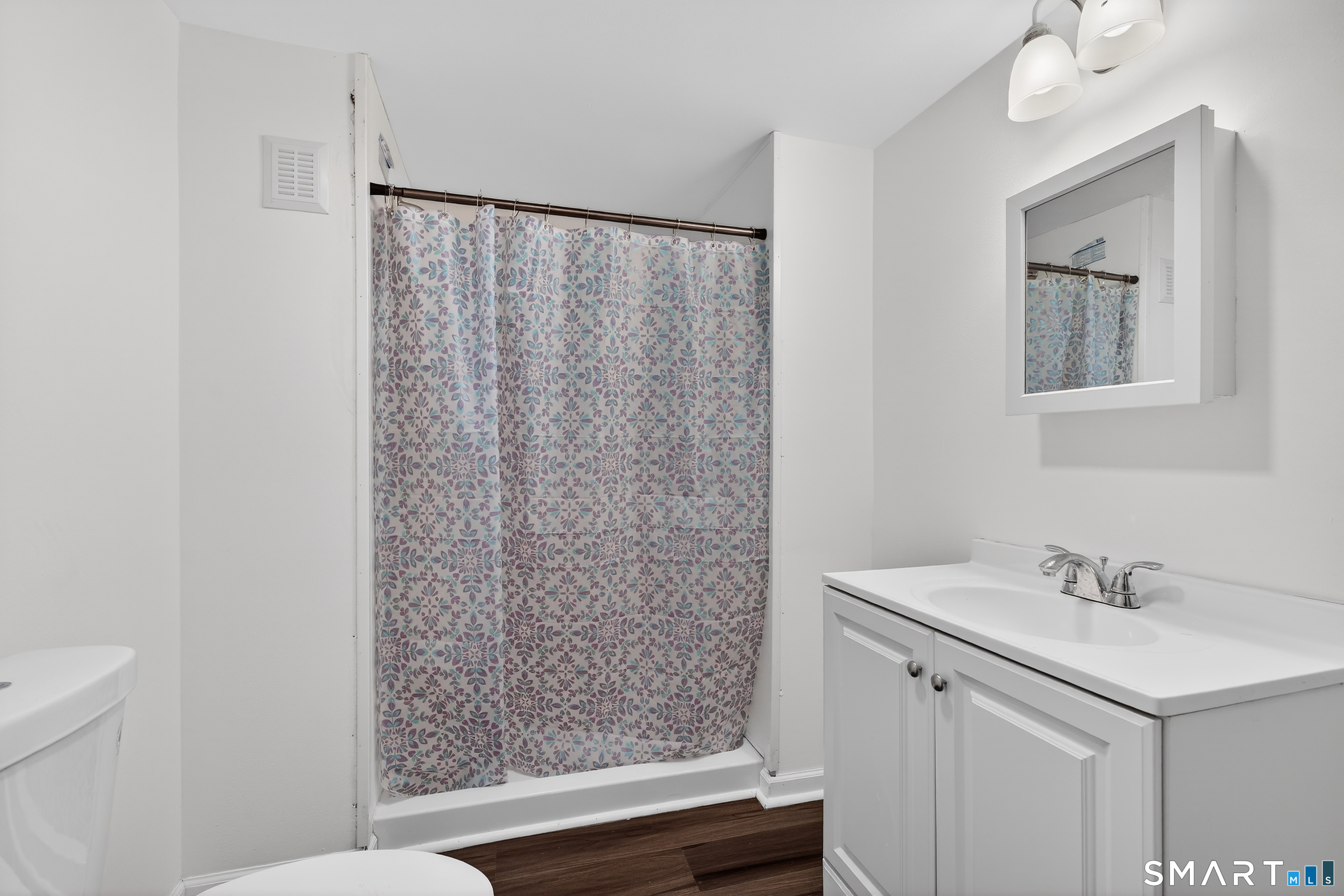 720 Baldwin Street Waterbury, CT 06706 - Photo 16 of 40 a bathroom with a sink and a mirror