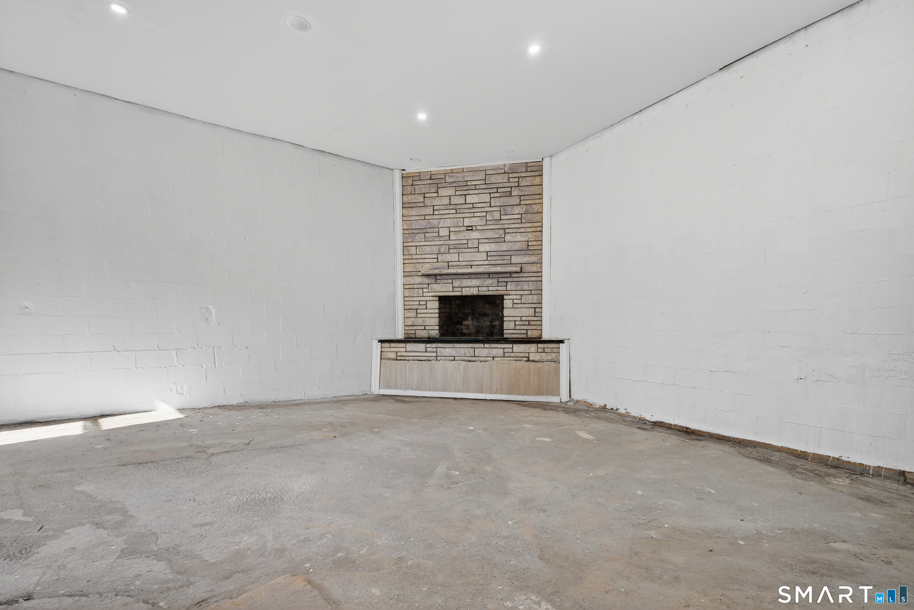 720 Baldwin Street Waterbury, CT 06706 - Photo 18 of 40 a view of an empty room with a fireplace