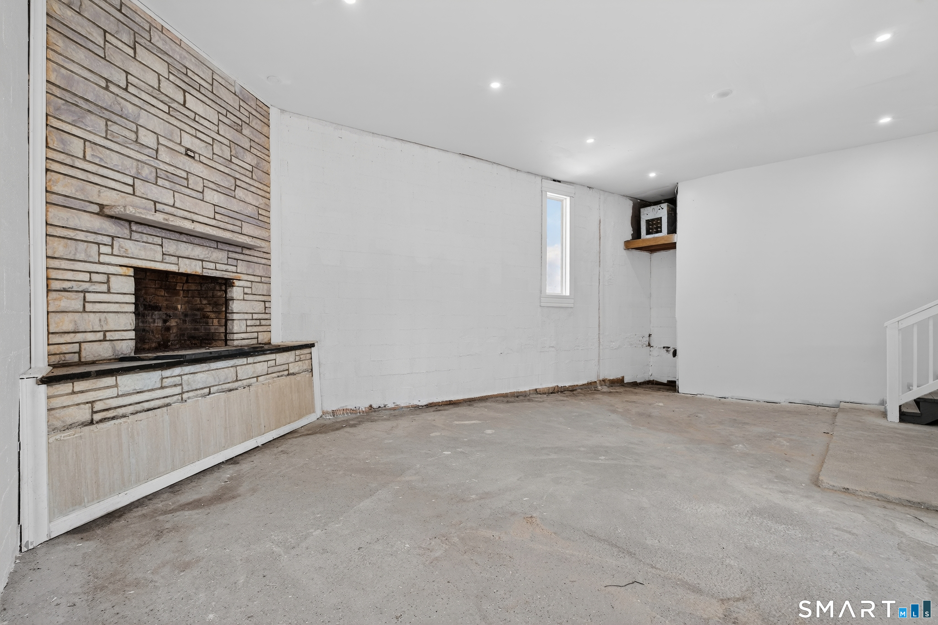 720 Baldwin Street Waterbury, CT 06706 - Photo 19 of 40 a view of an empty room with a fireplace