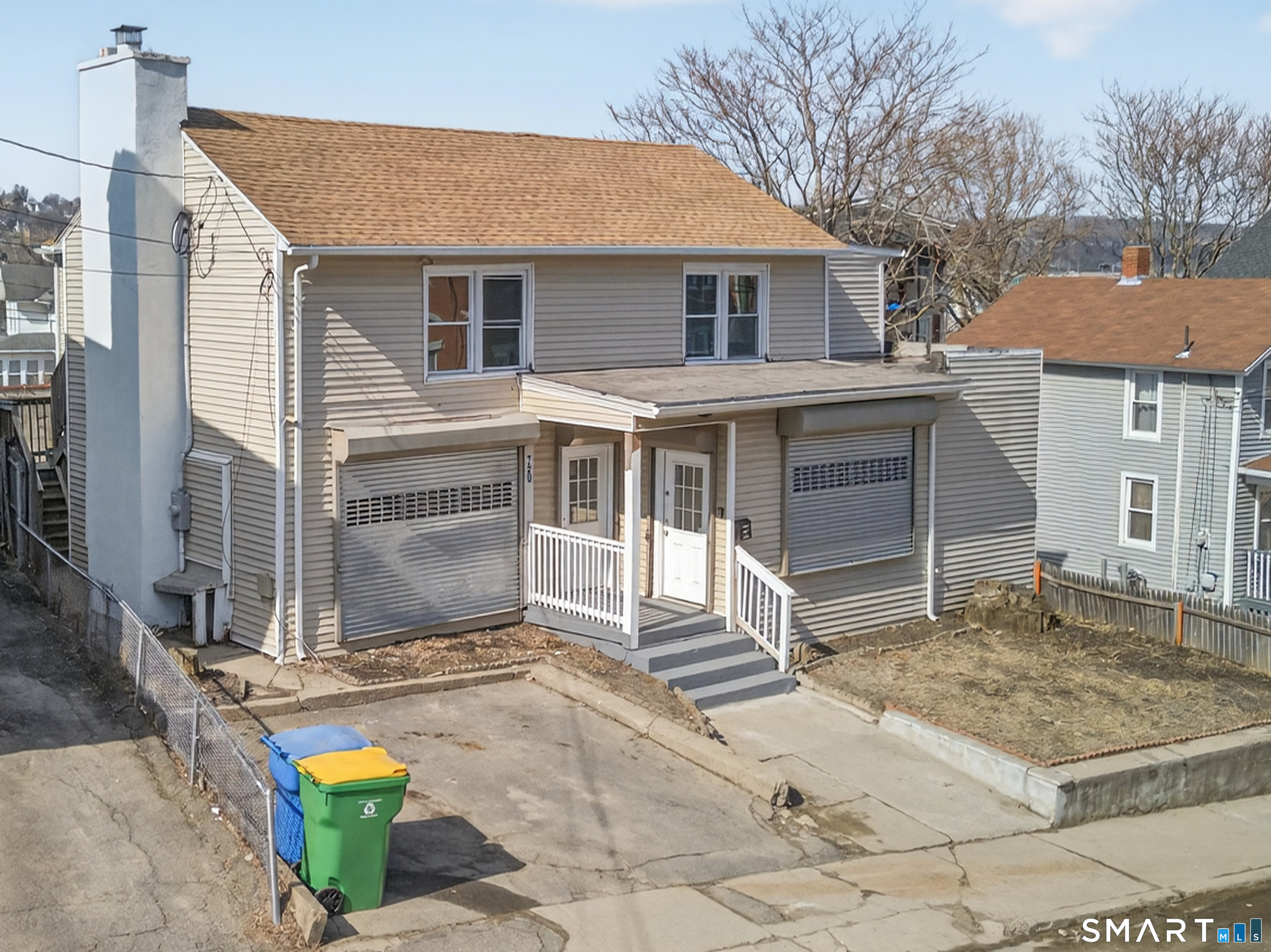 720 Baldwin Street Waterbury, CT 06706 - Photo 2 of 40 a front view of a house with a garage