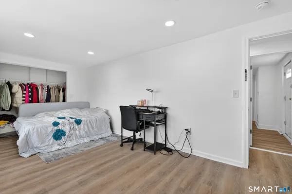 a bedroom with a bed and a table in it