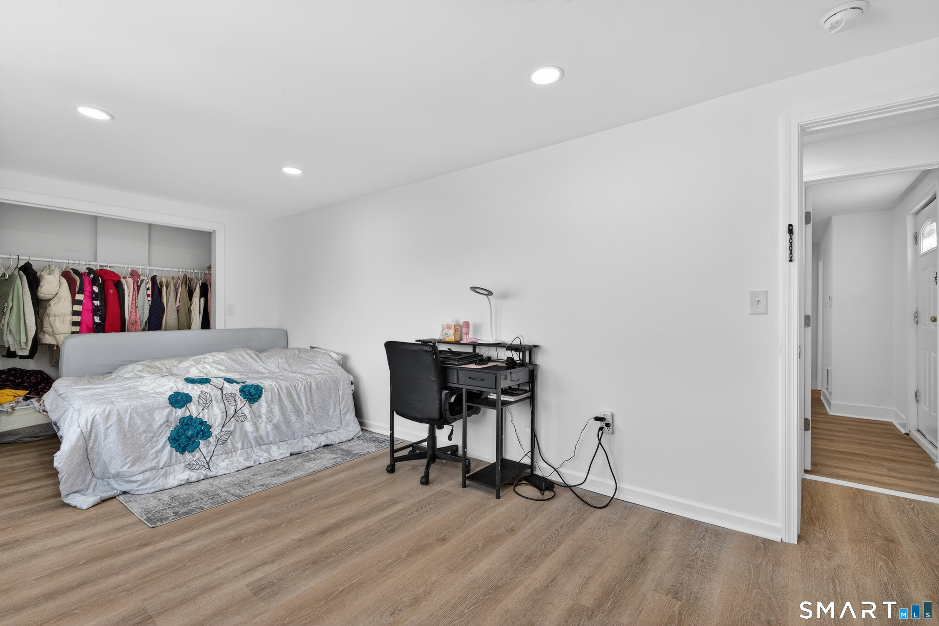 720 Baldwin Street Waterbury, CT 06706 - Photo 23 of 40 a bedroom with a bed and a table in it