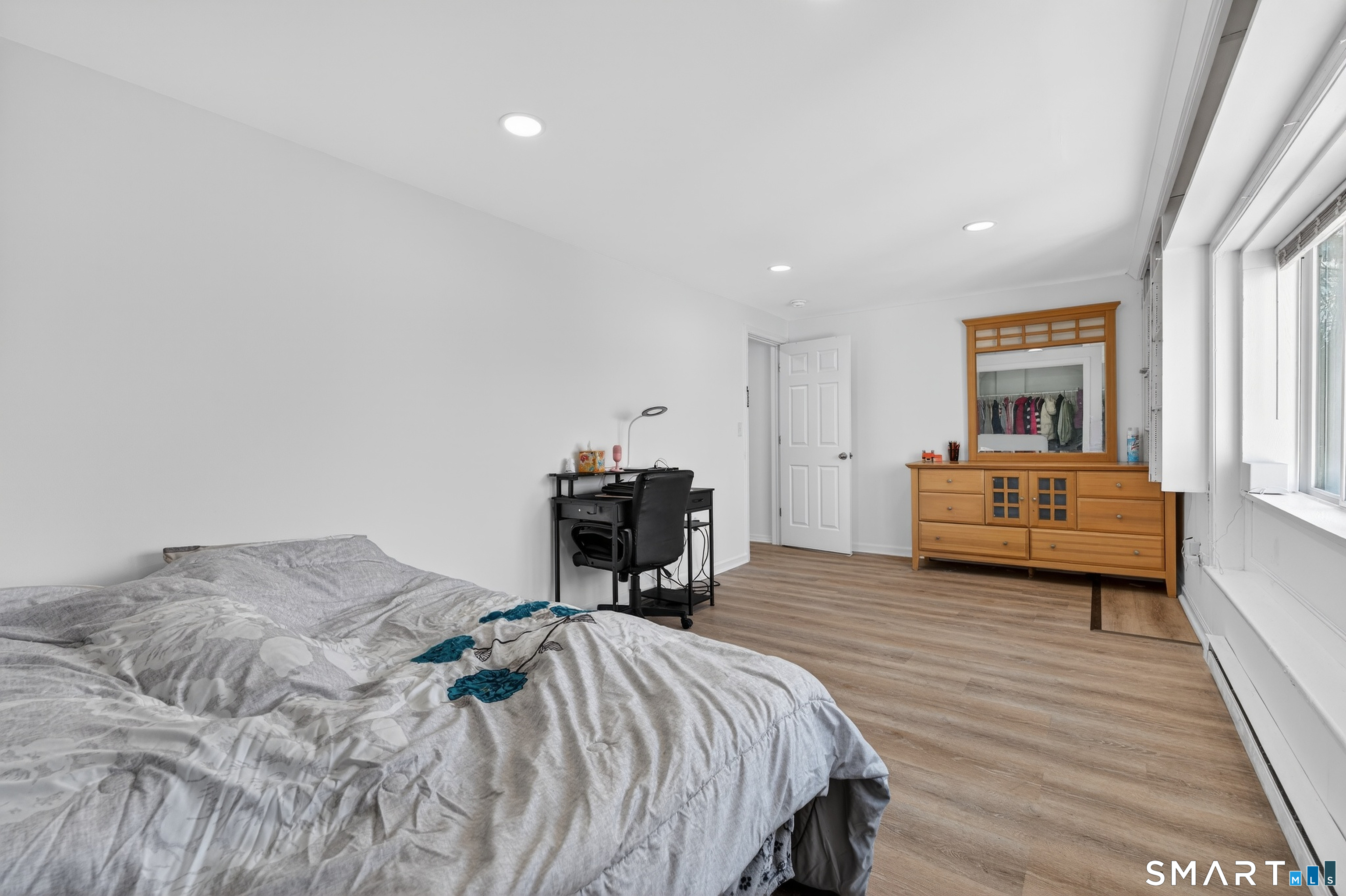 720 Baldwin Street Waterbury, CT 06706 - Photo 24 of 40 a bedroom with a bed and a chair
