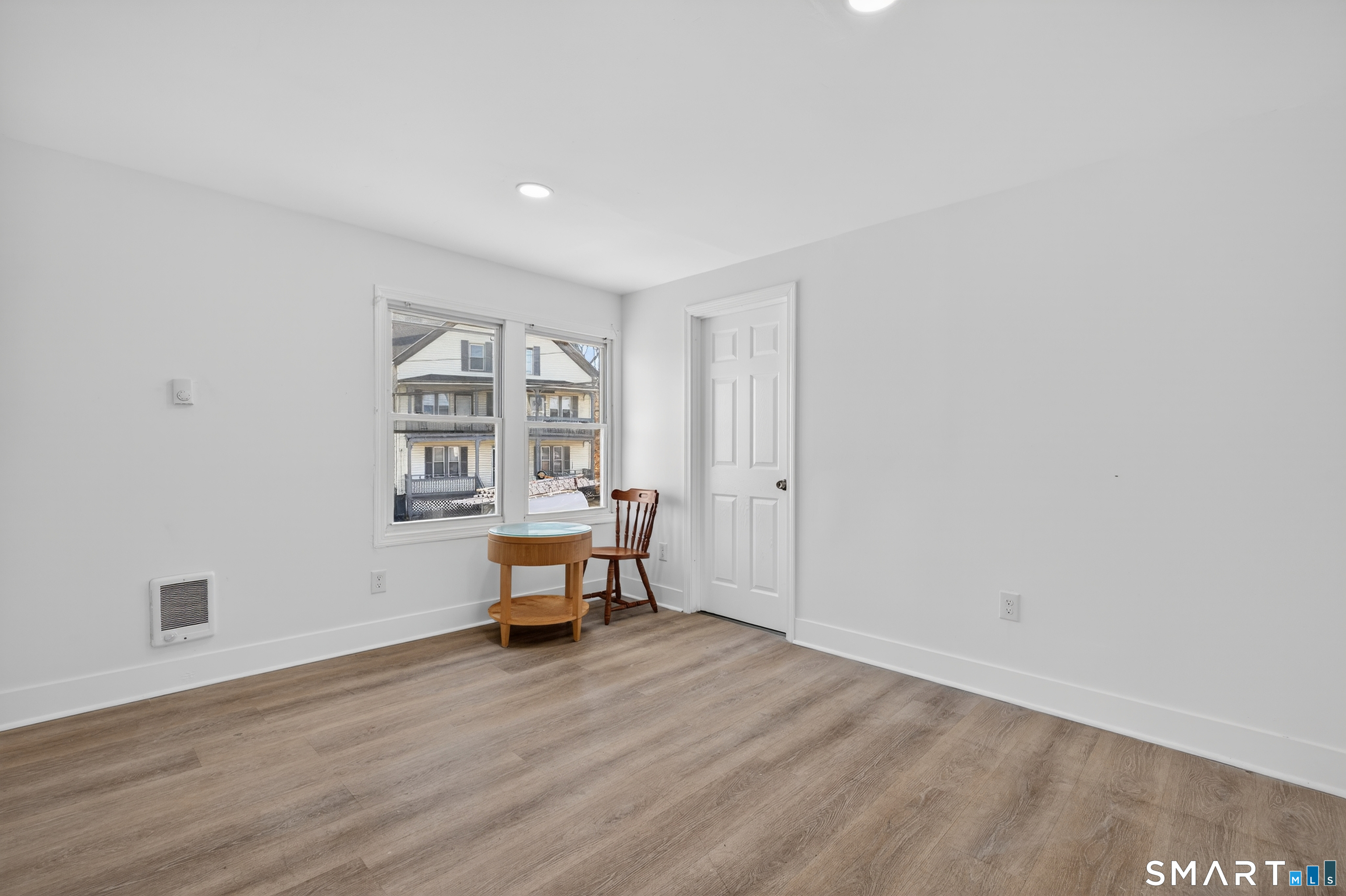 720 Baldwin Street Waterbury, CT 06706 - Photo 27 of 40 a view of a livingroom with wooden floor and a window