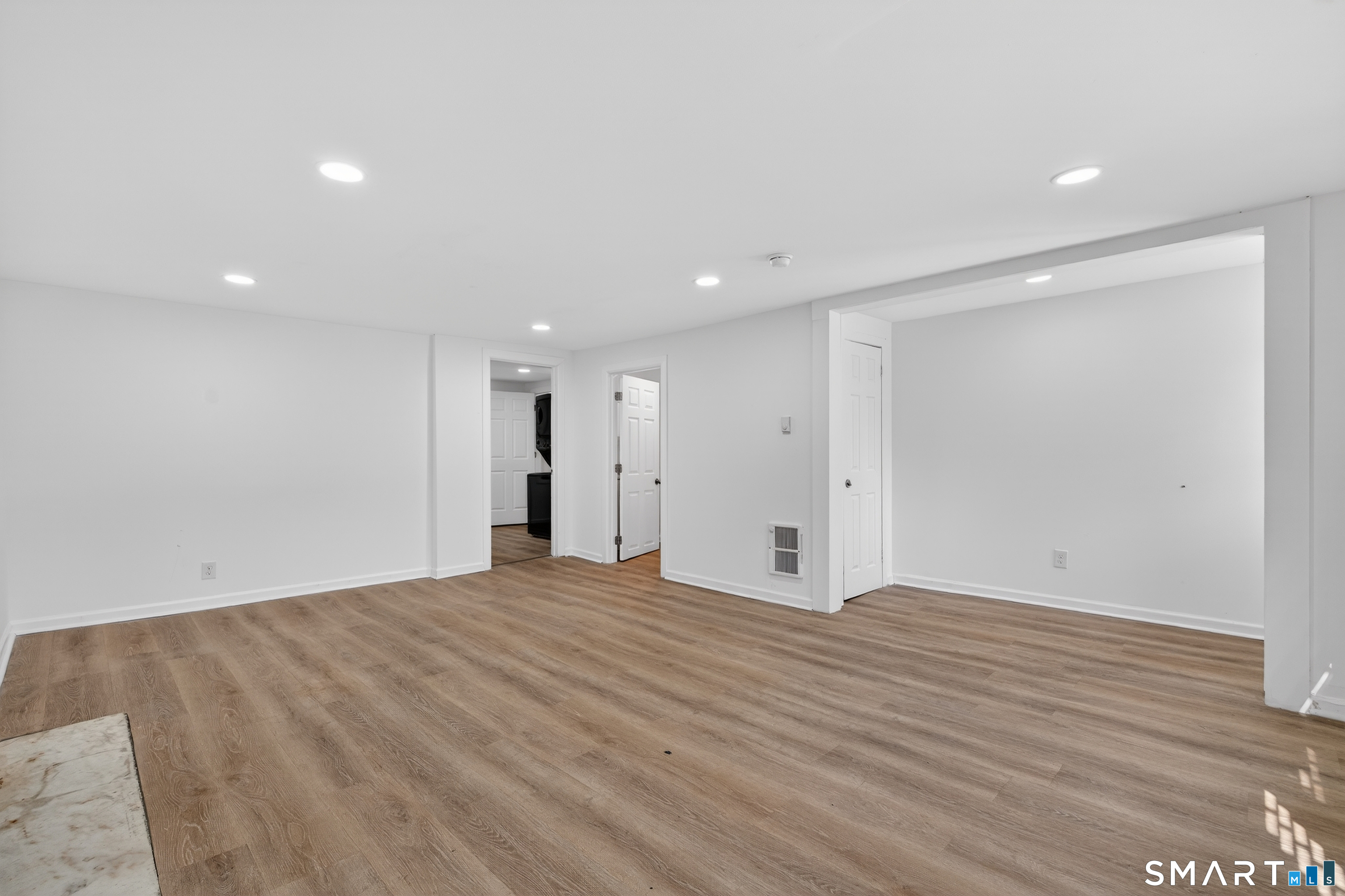 720 Baldwin Street Waterbury, CT 06706 - Photo 7 of 40 a view of an empty room with wooden floor