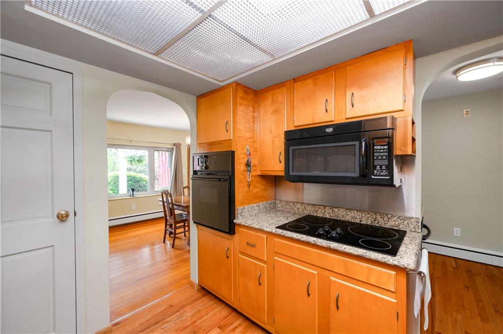 120 West Sunbury Road Butler, PA 16001 - Photo 11 of 46 a kitchen with stainless steel appliances granite countertop a stove a sink and a microwave