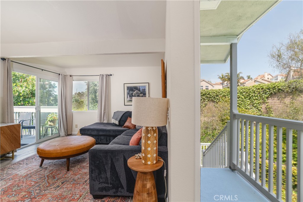 34028 Selva Road, Unit 75 Dana Point, CA 92629 - Photo 11 of 45 a living room with furniture a table and a large window