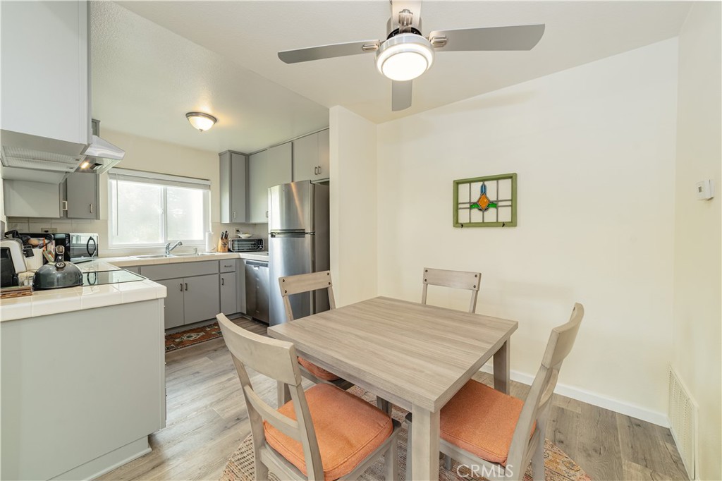 34028 Selva Road, Unit 75 Dana Point, CA 92629 - Photo 14 of 45 a kitchen with sink cabinets and stainless steel appliances
