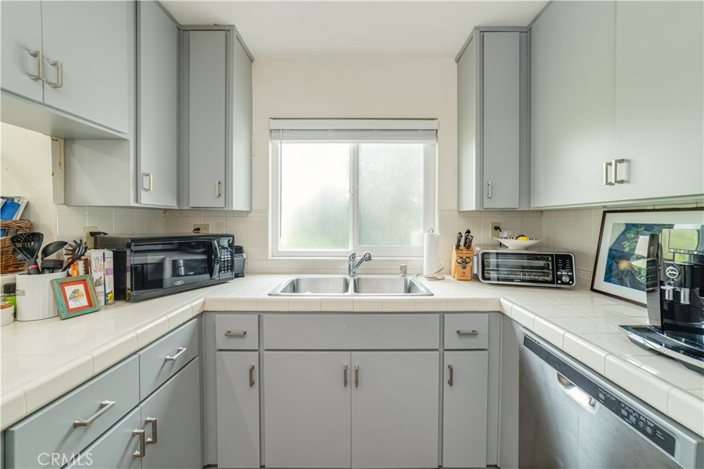 34028 Selva Road, Unit 75 Dana Point, CA 92629 - Photo 18 of 45 a kitchen with sink cabinets and window
