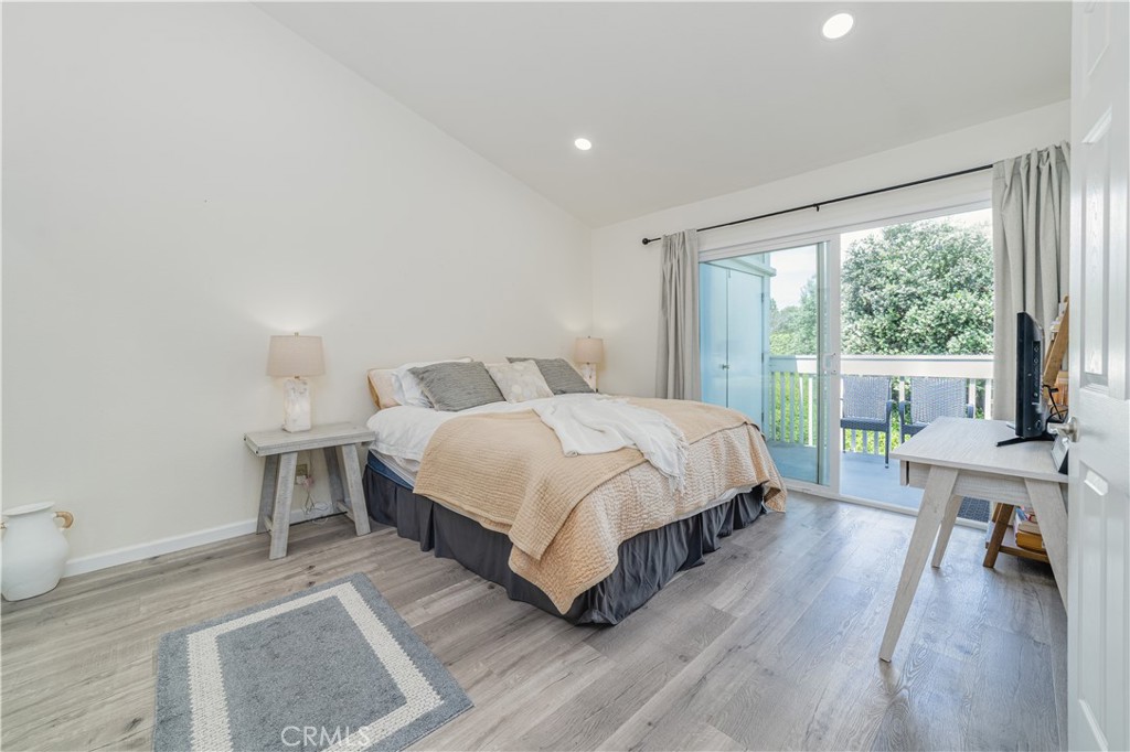 34028 Selva Road, Unit 75 Dana Point, CA 92629 - Photo 19 of 45 a bedroom with a bed and a large window