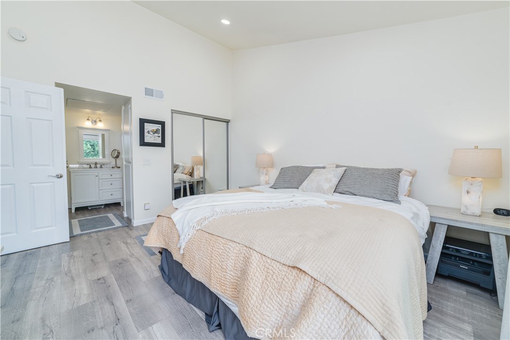 34028 Selva Road, Unit 75 Dana Point, CA 92629 - Photo 20 of 45 a bedroom with a bed and a table