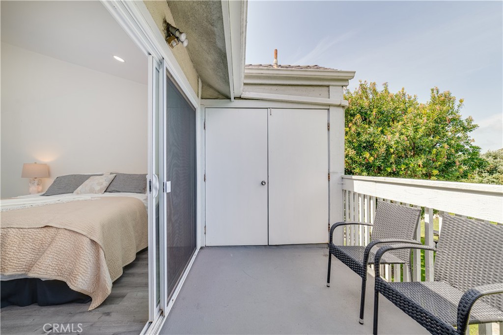 34028 Selva Road, Unit 75 Dana Point, CA 92629 - Photo 29 of 45 a view of a bedroom with furniture and staircase