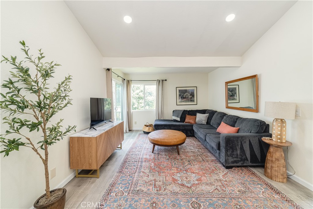 34028 Selva Road, Unit 75 Dana Point, CA 92629 - Photo 8 of 45 a living room with furniture and a flat screen tv