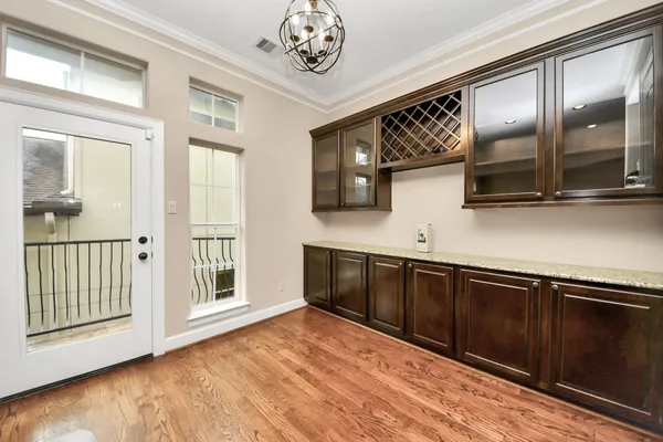 a view of kitchen with stainless steel appliances granite countertop a refrigerator and a sink