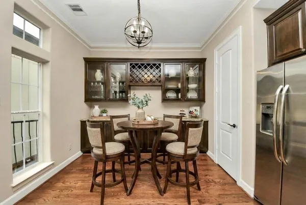 a view of a dining room with furniture window and wooden floor