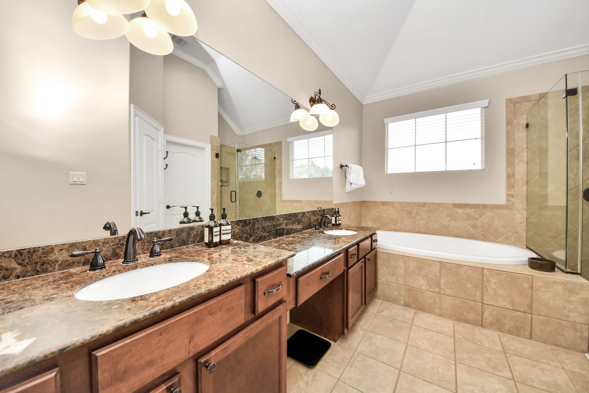 4506 Feagan Street, Unit B Houston, TX 77007 - Photo 27 of 35 a bathroom with a granite countertop sink a toilet a mirror and bathtub
