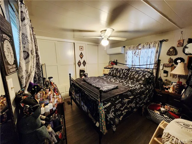 a bed sitting in a room next to a window