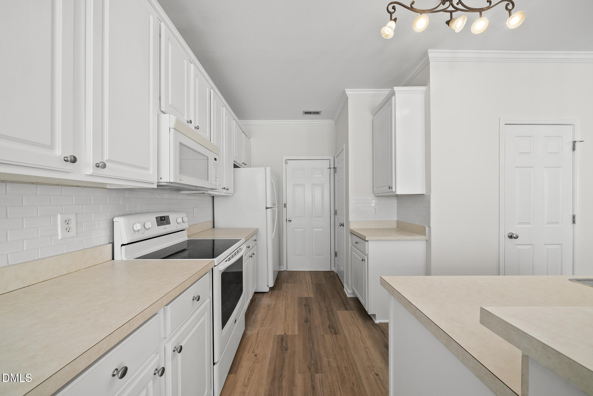 1024 Goldmist Lane Durham, NC 27713 - Photo 16 of 46 a kitchen with a stove a sink and a refrigerator