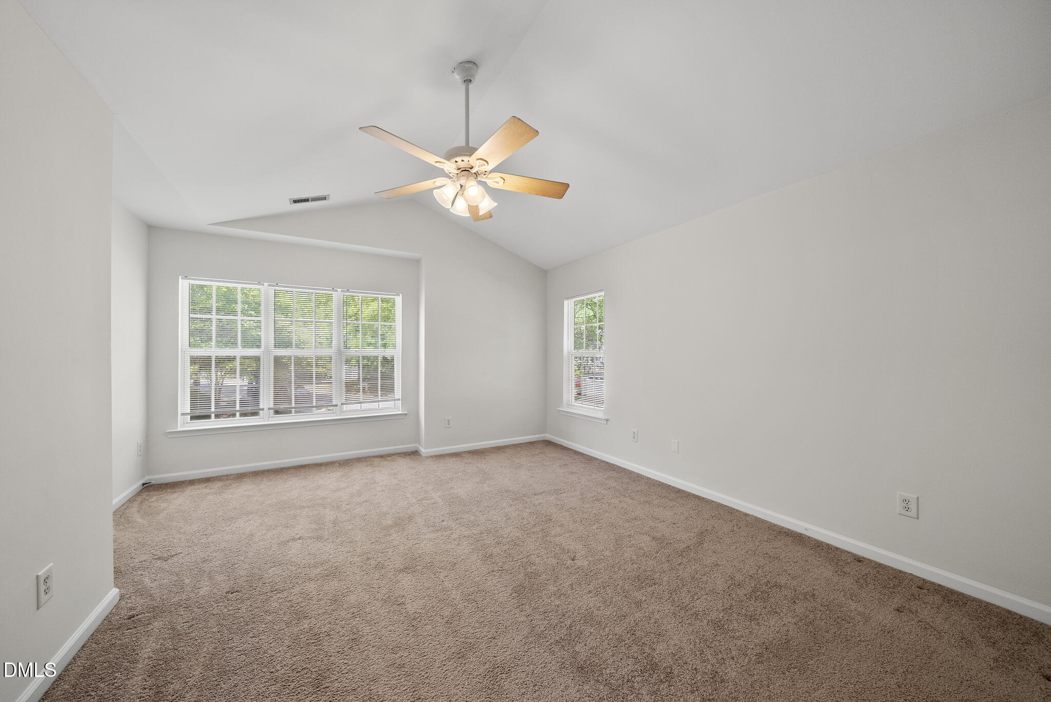 1024 Goldmist Lane Durham, NC 27713 - Photo 17 of 46 an empty room with windows and fan