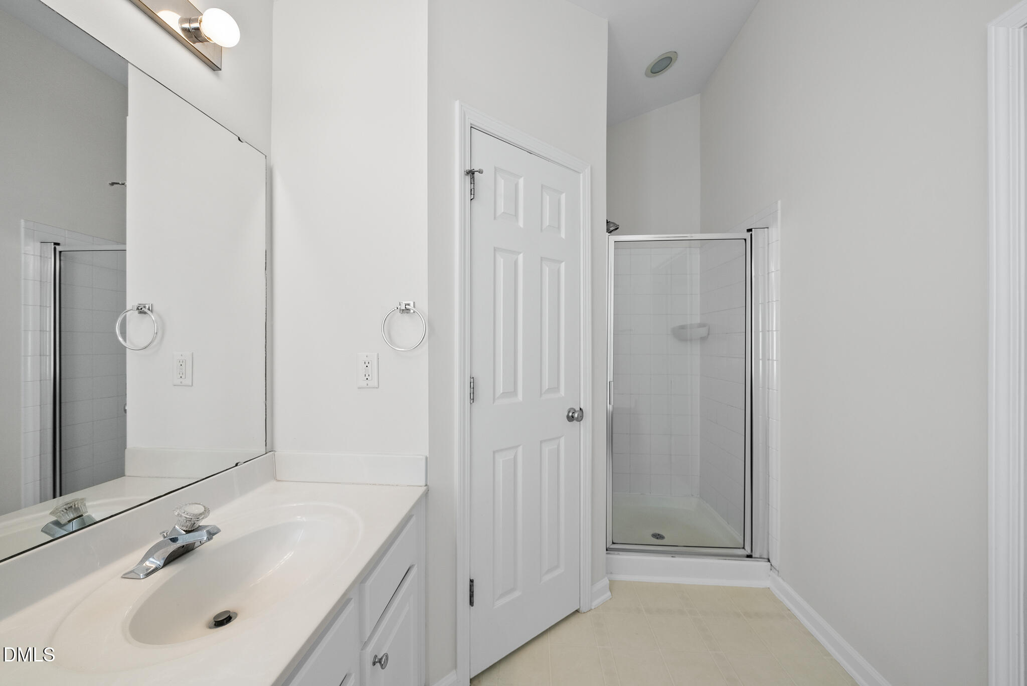 1024 Goldmist Lane Durham, NC 27713 - Photo 22 of 46 a bathroom with a sink mirror and shower