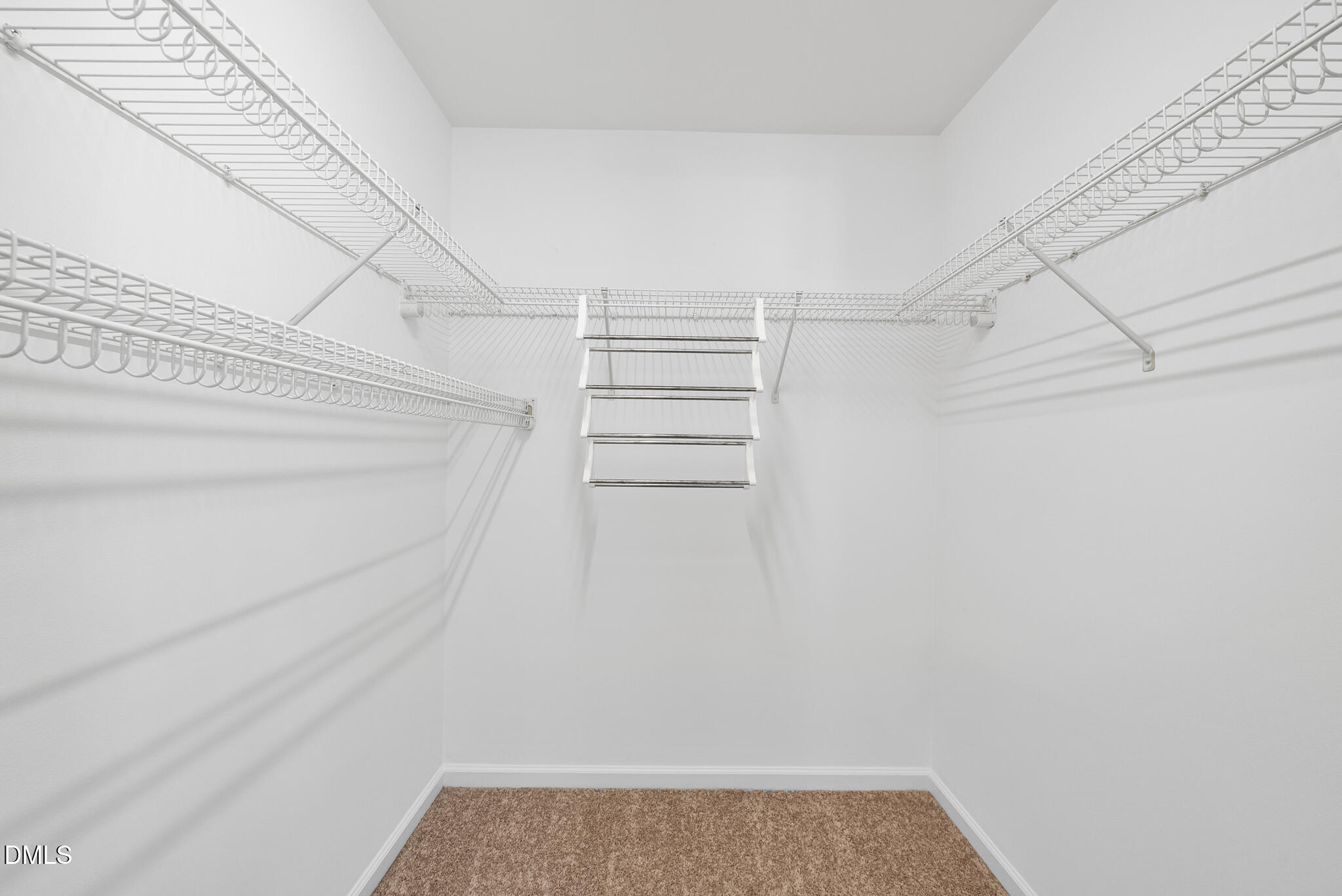 1024 Goldmist Lane Durham, NC 27713 - Photo 24 of 46 a view of walk in closet with empty racks