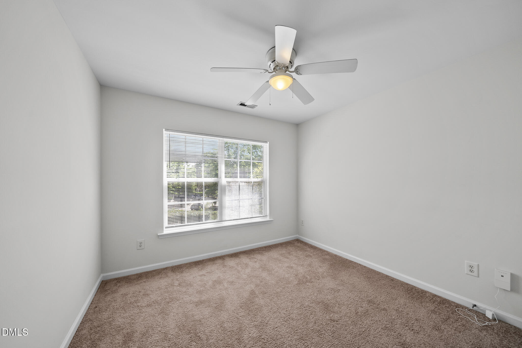 1024 Goldmist Lane Durham, NC 27713 - Photo 26 of 46 an empty room with a window and a fan