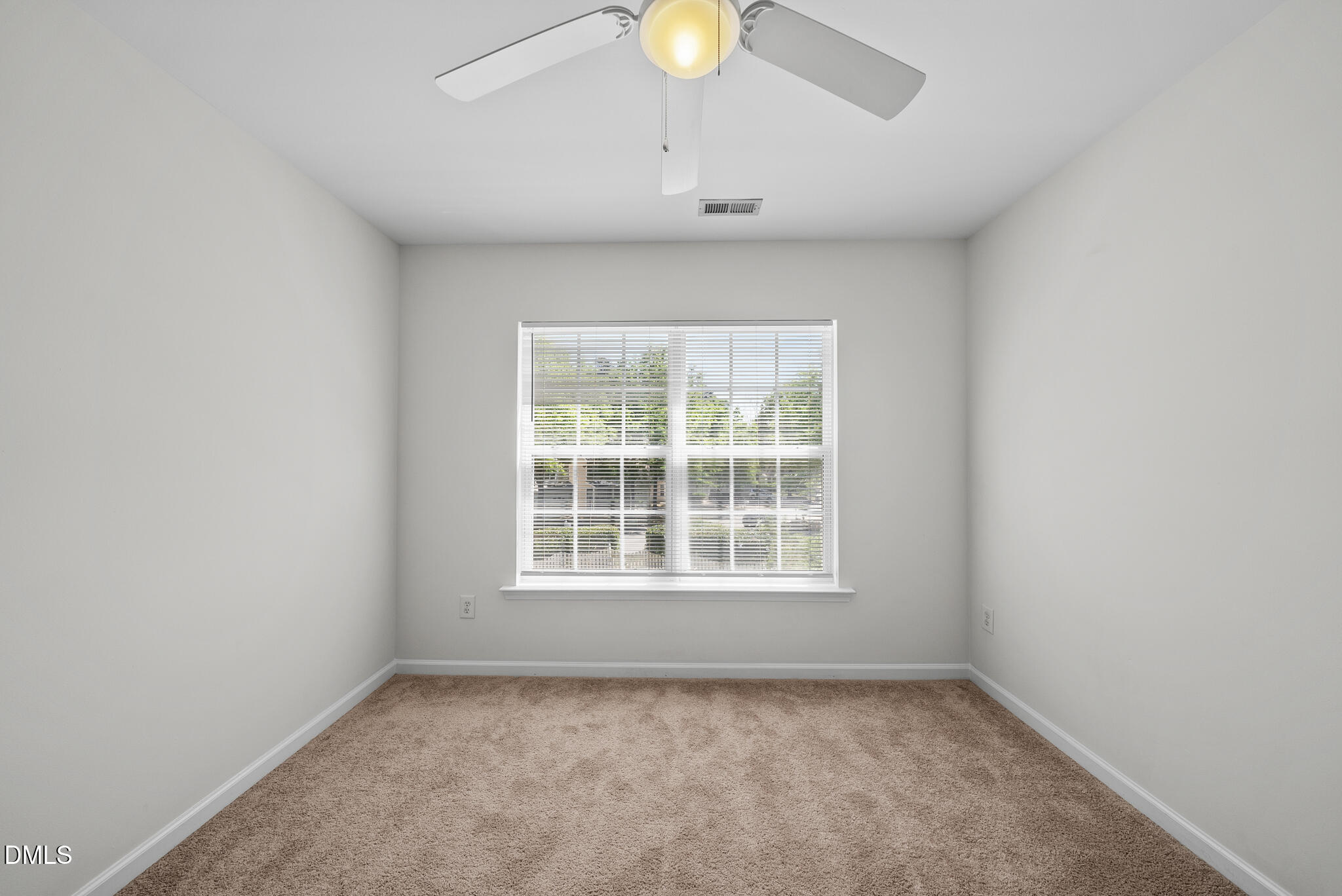 1024 Goldmist Lane Durham, NC 27713 - Photo 27 of 46 an empty room with a window and a fan